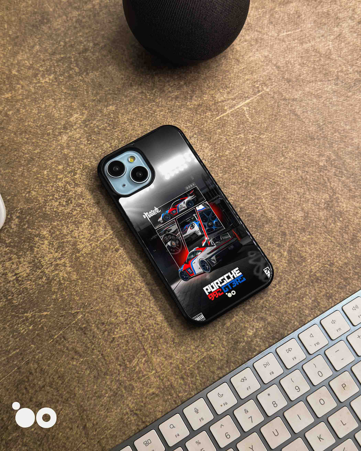Porsche 911 GT3 RS iPhone case featuring a motorsport collage of racing cars, detailed graphics and red, blue and black accents.