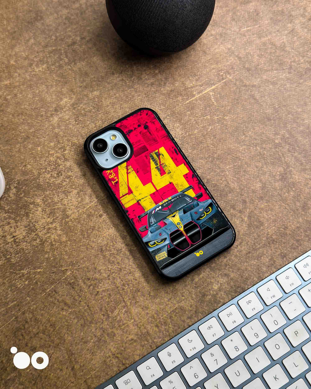 BMW M4 GT3-44 designer iPhone case featuring a front-view BMW M4 GT3 race car with bold yellow 44 graphics on red.