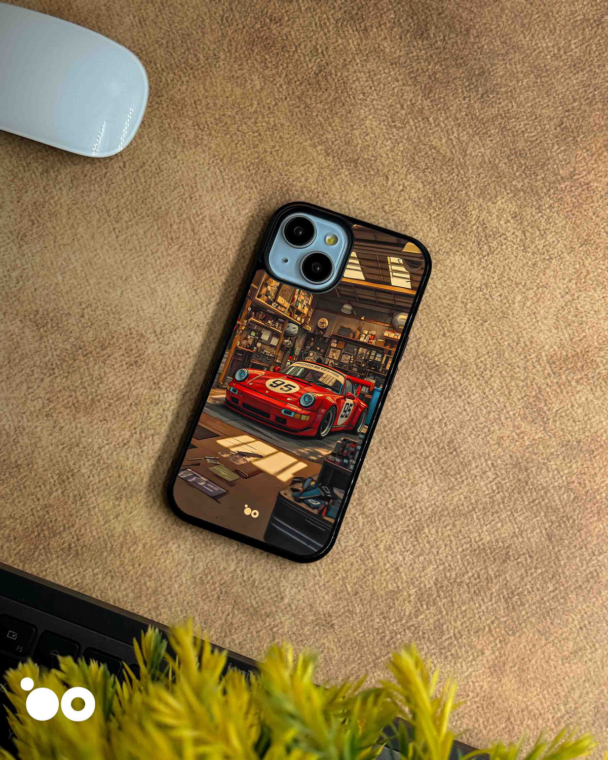 Porsche 911 iPhone case featuring a vintage red racing Porsche with number 95, parked inside a detailed retro garage with warm lighting, workshop tools and automotive memorabilia.