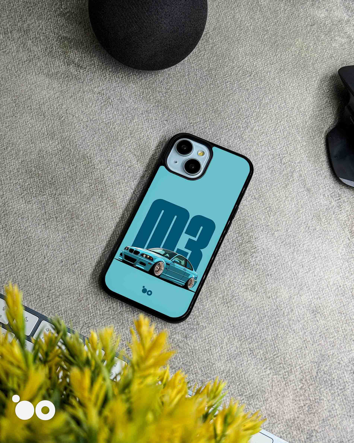 BMW M3 E46 Blue designer iPhone case featuring a blue BMW E46 M3 sports car with bold M3 typography on a light blue background.