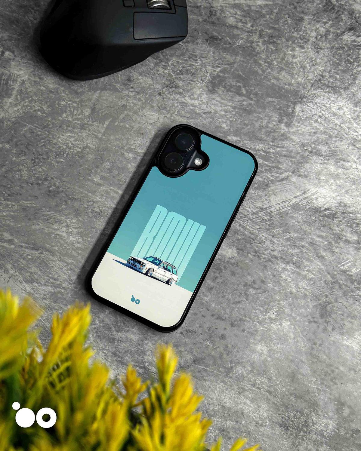 BMW E30 Touring designer iPhone case featuring a classic white BMW E30 station wagon with bold BMW typography on a teal background.