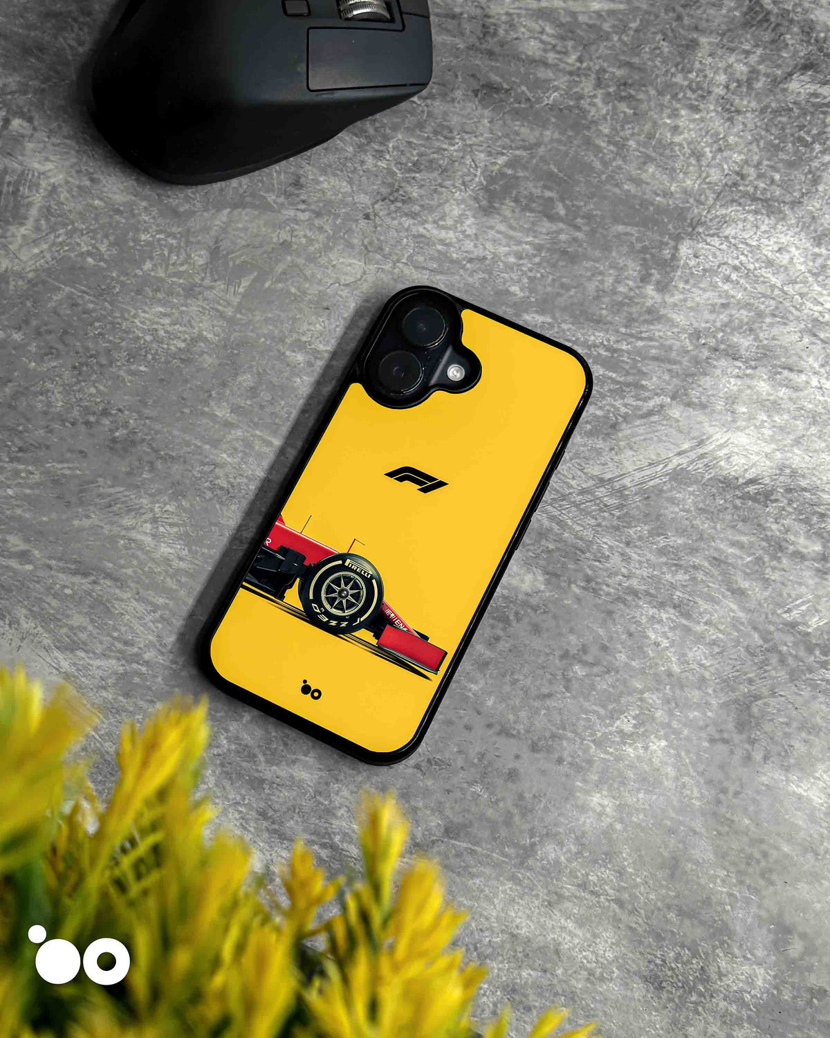 Paddock Yellow iPhone case featuring a red Ferrari Formula 1 car, Pirelli racing tyre and black F1 logo on yellow