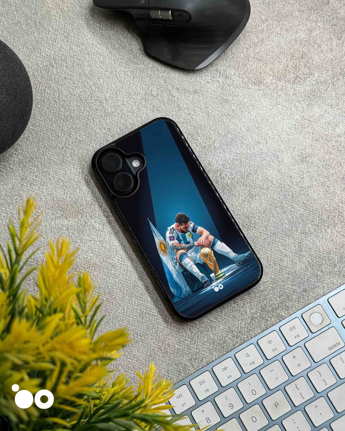 Lionel Messi After Glory iPhone case featuring Messi seated beside the World Cup trophy with Argentina flag and blue spotlight