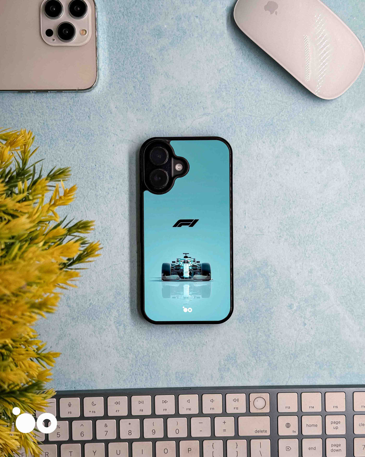 Silver Arrow Mercedes-AMG iPhone case featuring a front-facing Formula 1 racing car, F1 logo and turquoise gradient