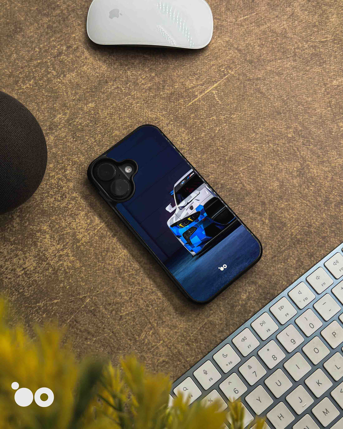 BMW M4 GT3 iPhone case featuring a front view of the blue, white and black motorsport race car against a dark navy background.