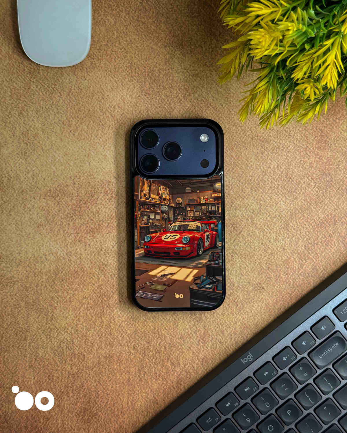 Porsche 911 iPhone case featuring a vintage red racing Porsche with number 95, parked inside a detailed retro garage with warm lighting, workshop tools and automotive memorabilia.