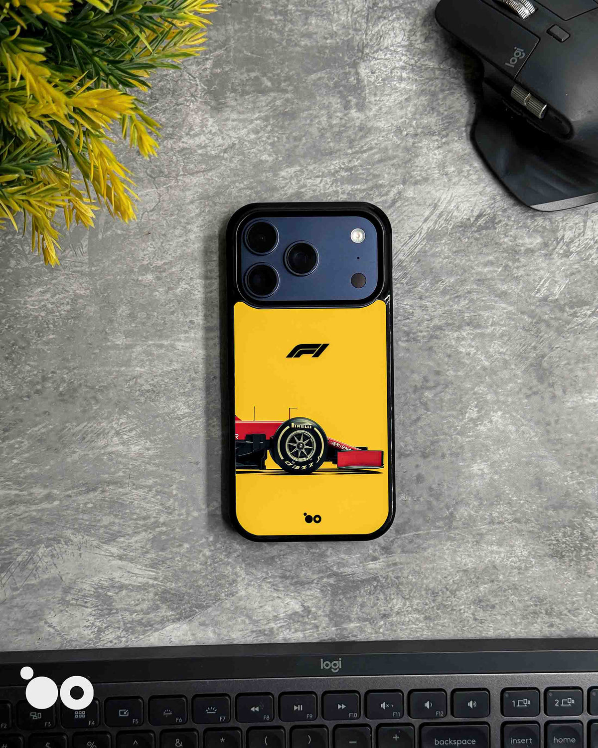 Paddock Yellow iPhone case featuring a red Ferrari Formula 1 car, Pirelli racing tyre and black F1 logo on yellow