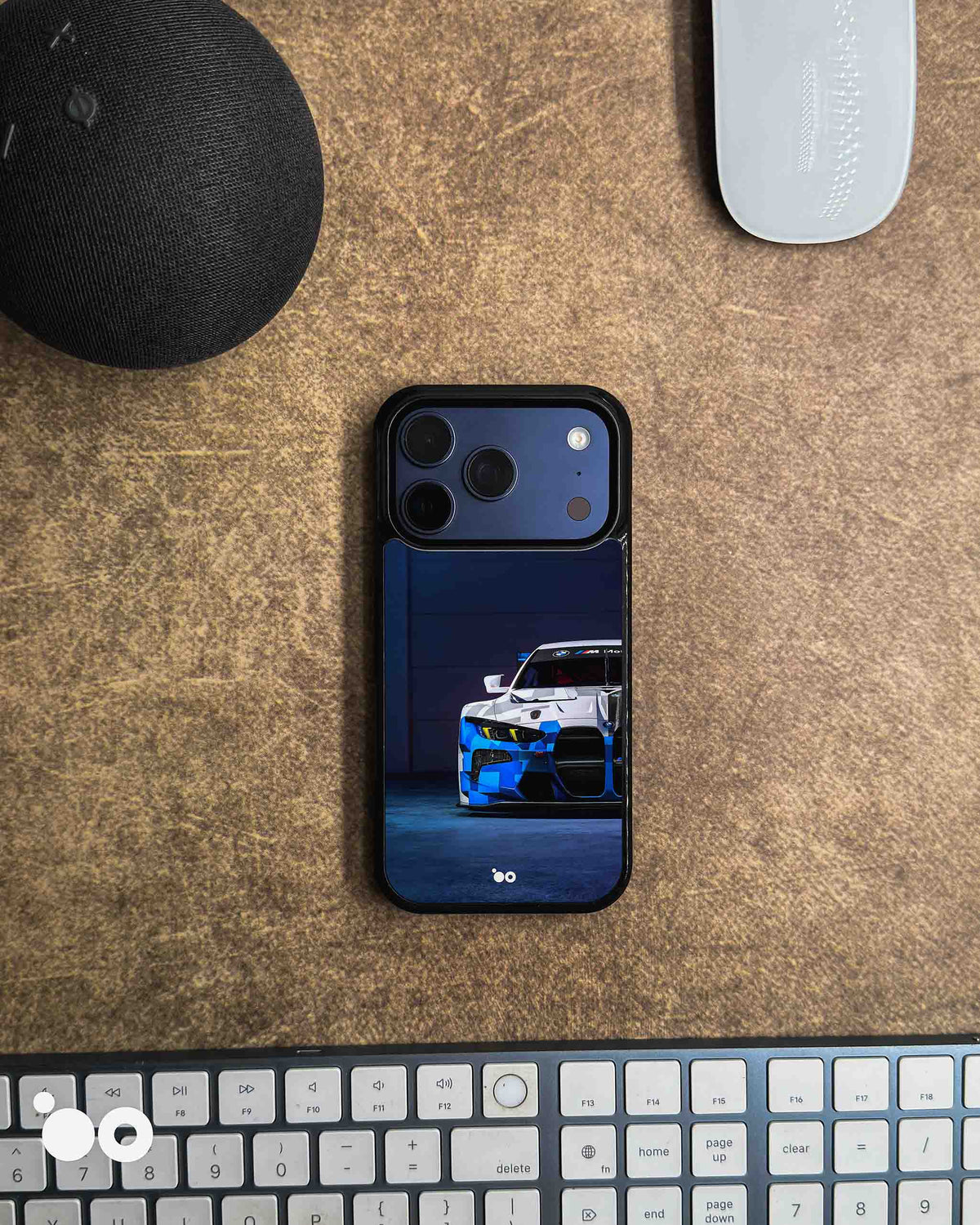 BMW M4 GT3 iPhone case featuring a front view of the blue, white and black motorsport race car against a dark navy background.