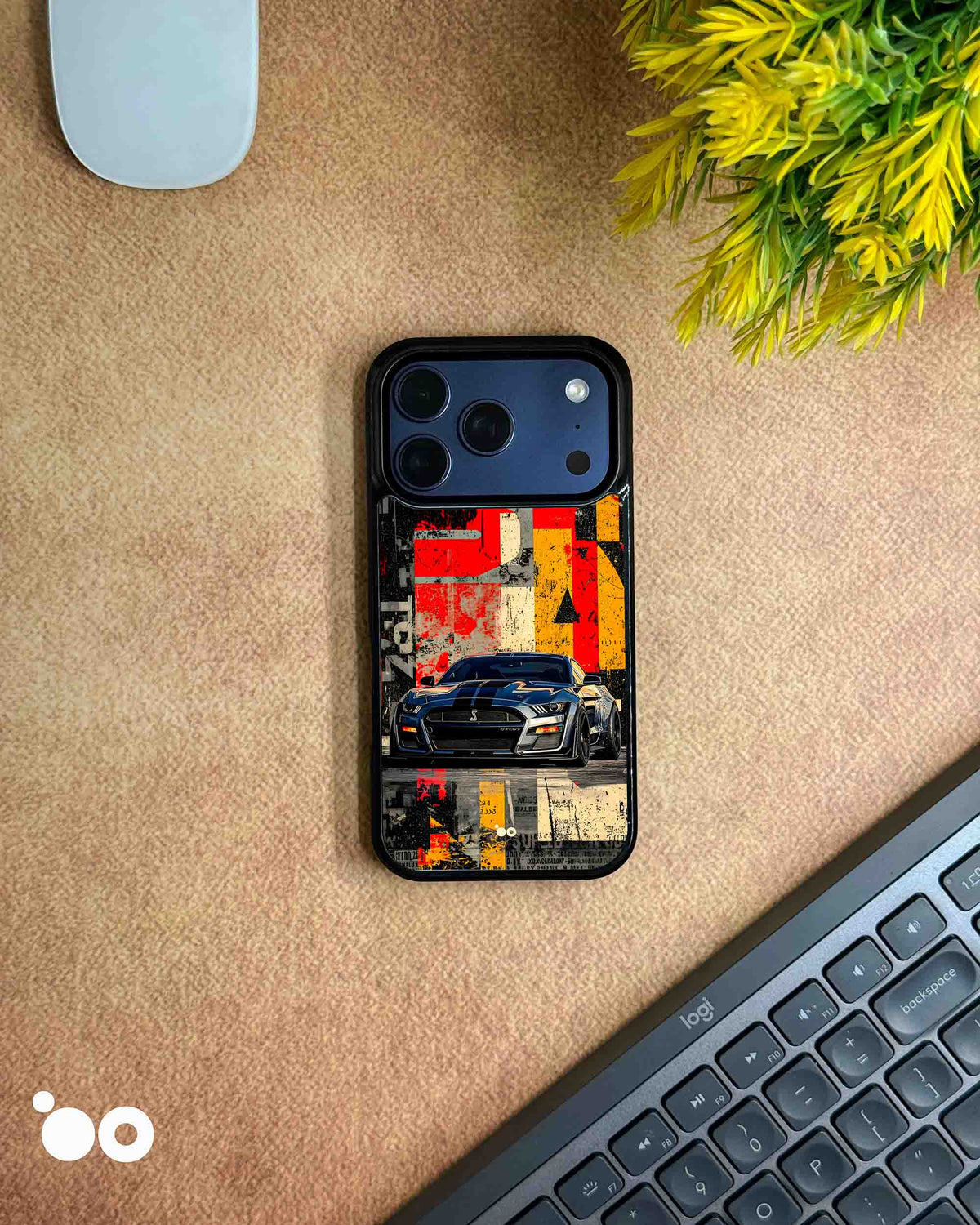 Asphalt Rebellion iPhone case featuring a dark Ford Mustang muscle car with distressed red, yellow and black graphics