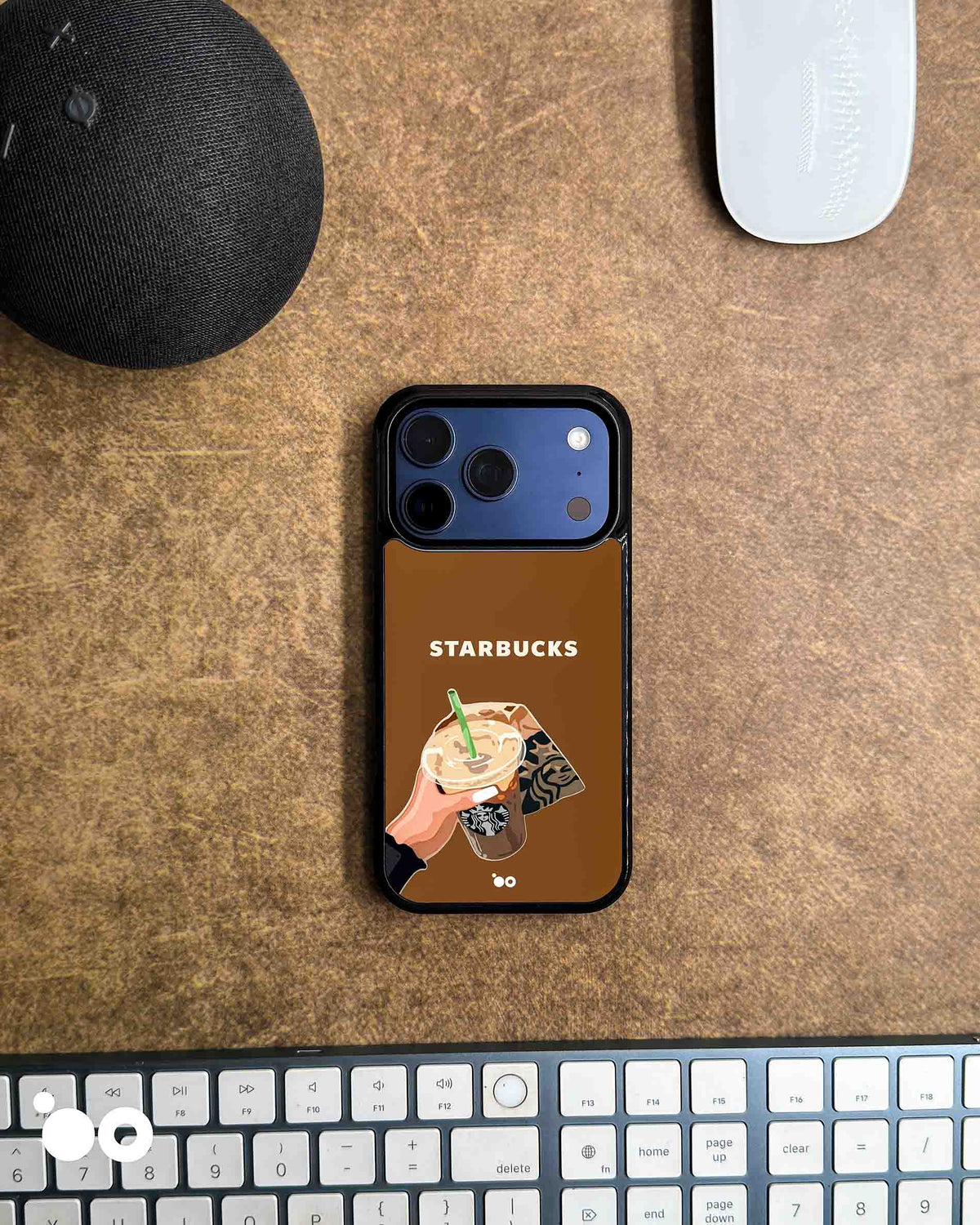 Iced Coffee Moment iPhone case artwork with a hand holding Starbucks iced coffee, green straw and takeaway bag on brown