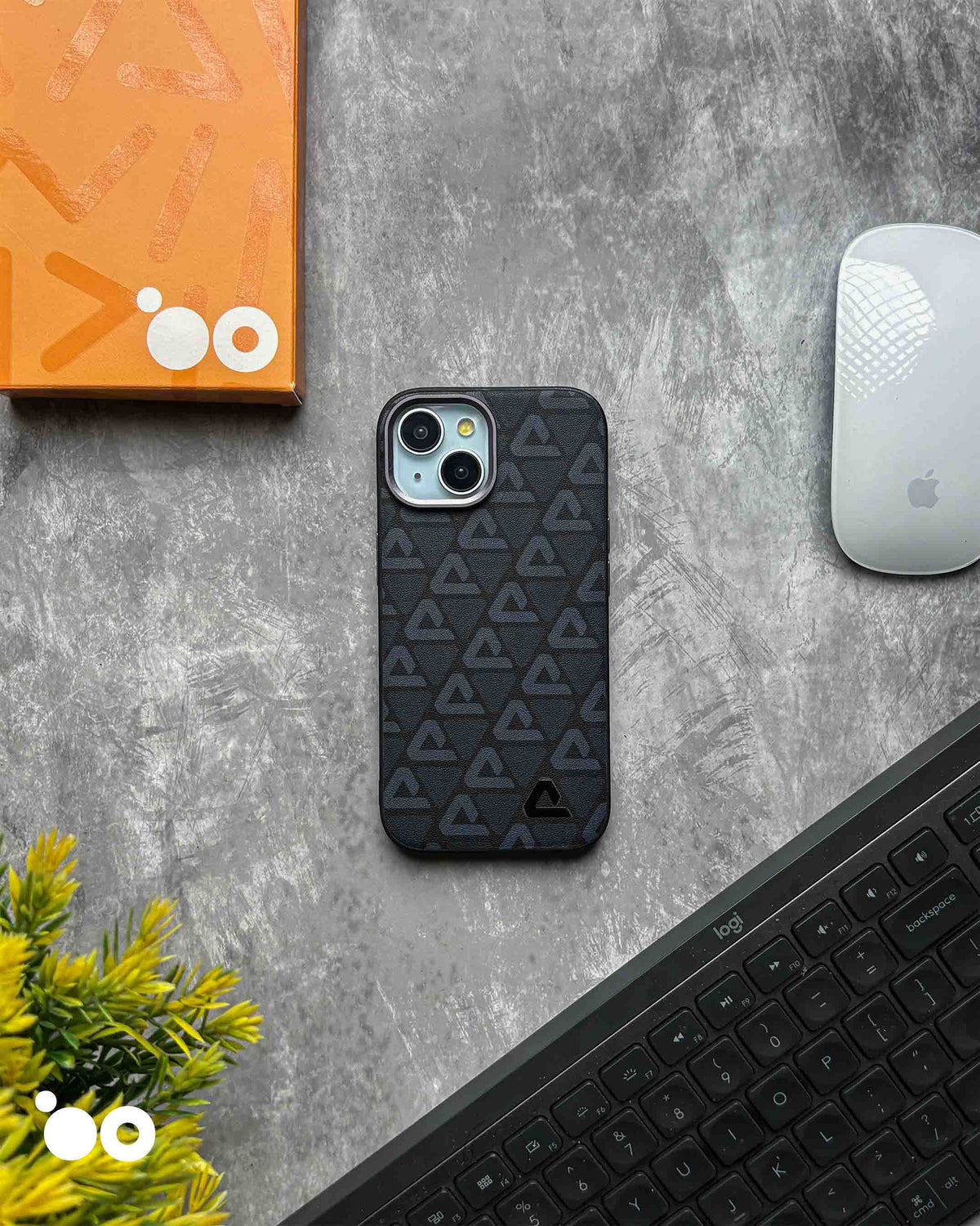 Vogue Leather Midnight Black iPhone case with subtle charcoal triangle motifs across a textured black back