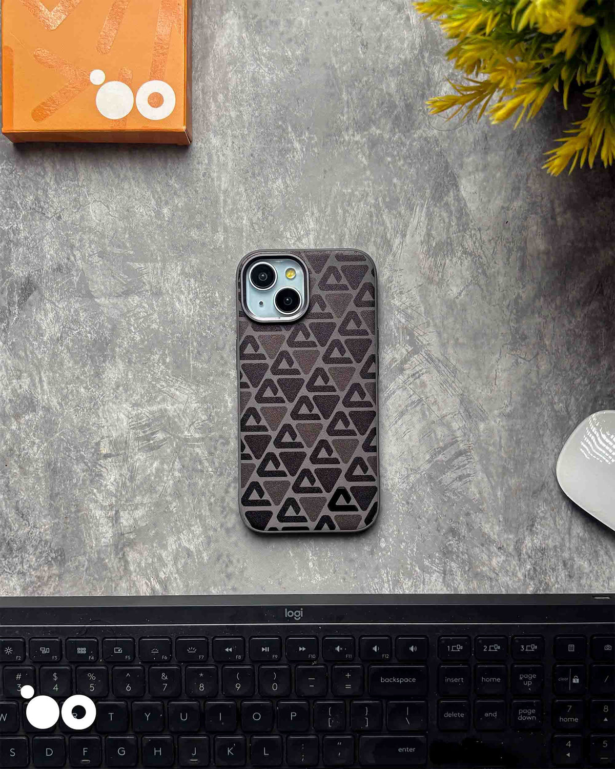 Vogue Leather Dark Grey iPhone case featuring repeating black triangular patterns on a textured dark grey back