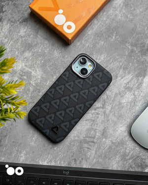 Vogue Leather Midnight Black iPhone case with subtle charcoal triangle motifs across a textured black back