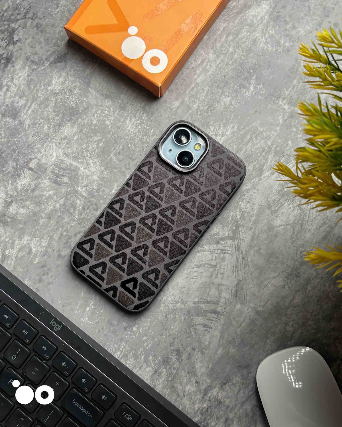 Vogue Leather Dark Grey iPhone case featuring repeating black triangular patterns on a textured dark grey back