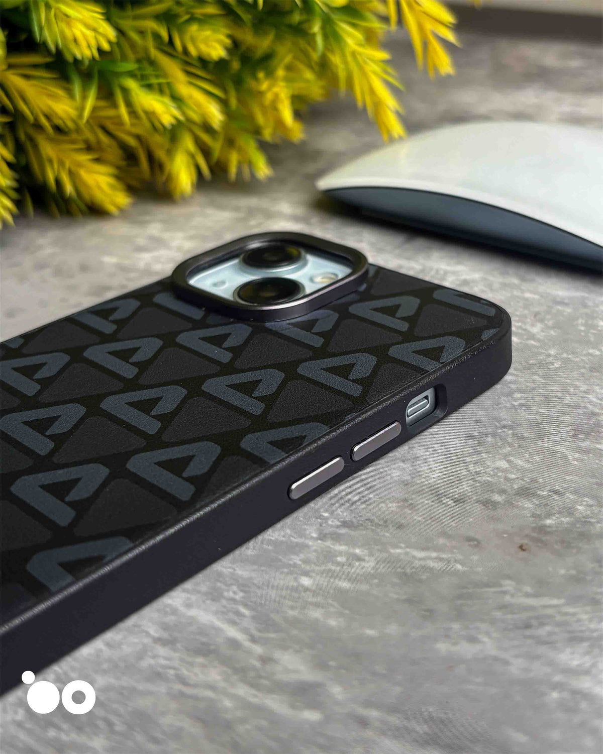 Vogue Leather Midnight Black iPhone case with subtle charcoal triangle motifs across a textured black back