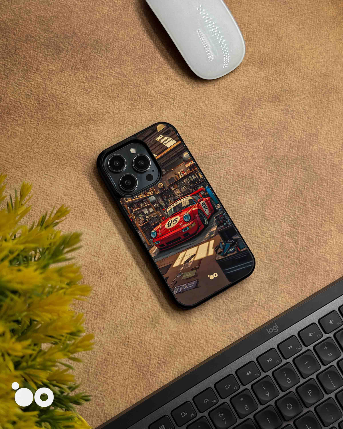 Porsche 911 iPhone case featuring a vintage red racing Porsche with number 95, parked inside a detailed retro garage with warm lighting, workshop tools and automotive memorabilia.