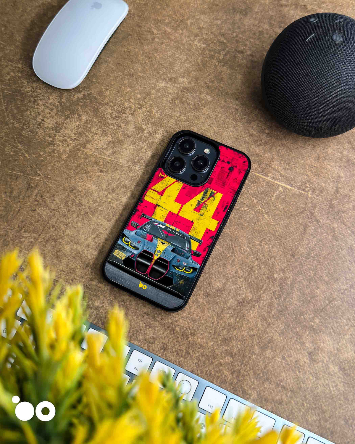 BMW M4 GT3-44 designer iPhone case featuring a front-view BMW M4 GT3 race car with bold yellow 44 graphics on red.